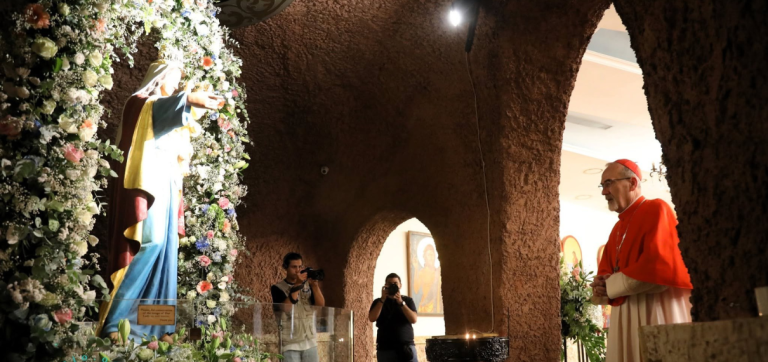Cardinal Pizzaballa prays in the cave where Jesus stopped with his mother